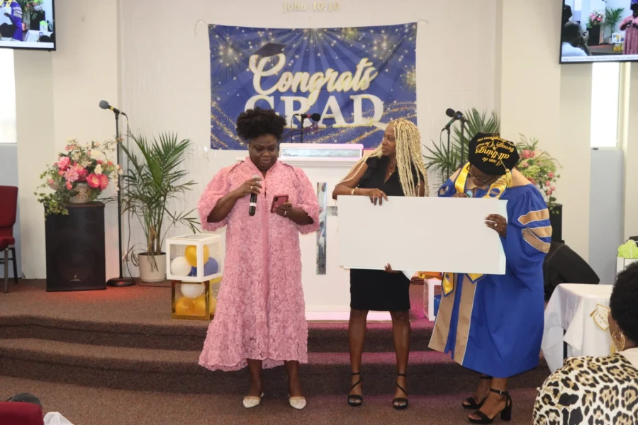 CGMOH representatives introduce a scholarship presentation during a graduation celebration