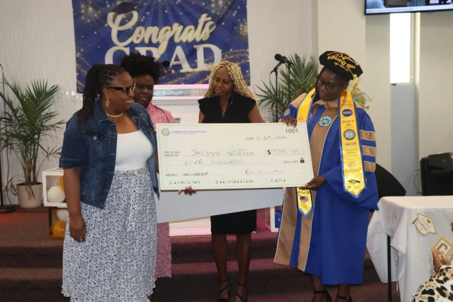 CGMOH representatives celebrate a scholarship recipient at the graduation ceremony