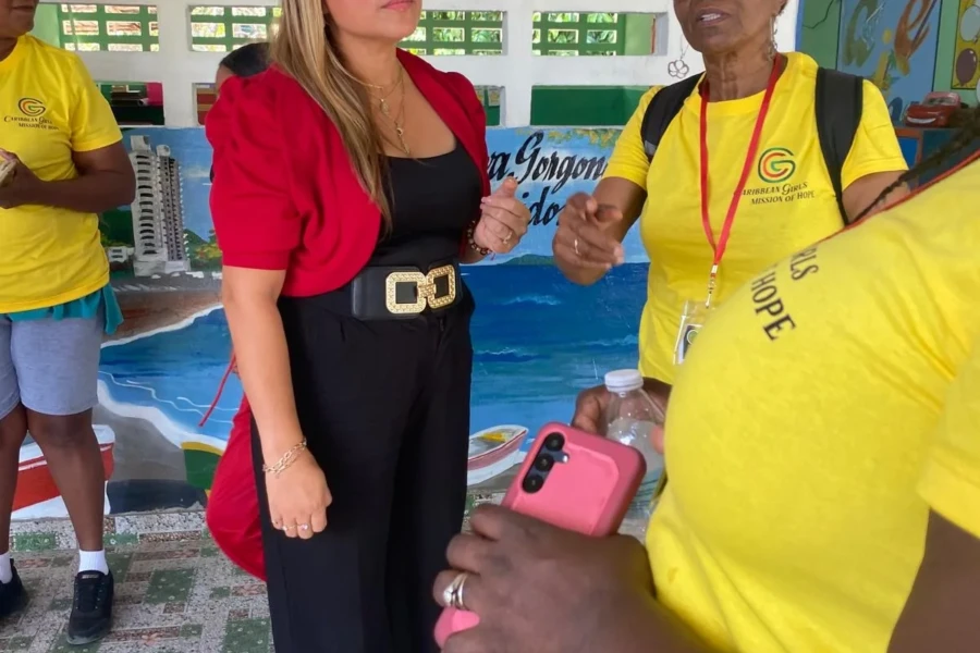 A community partner meets with a CGMOH volunteer at the children's center