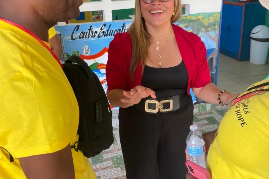 A CGMOH volunteer welcomes a local partner during the center visit