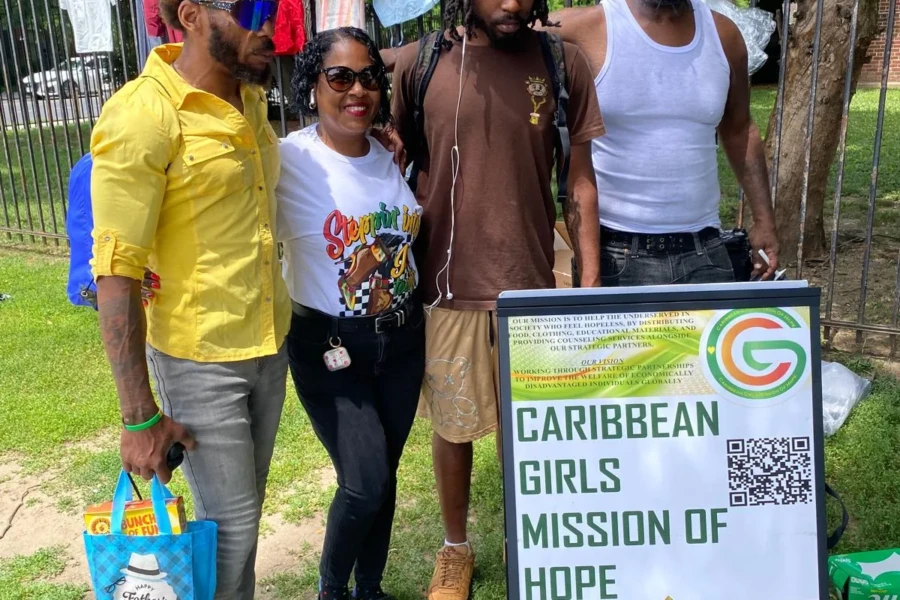 CGMOH volunteers and community members pose together at the Father's Day giveaway