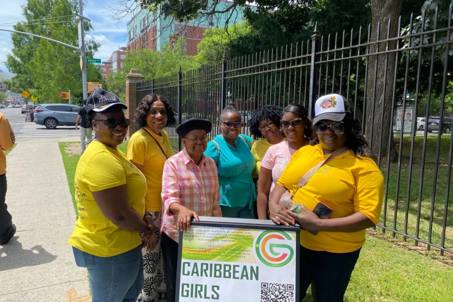 The Father's Day outreach team gathers around the CGMOH distribution table