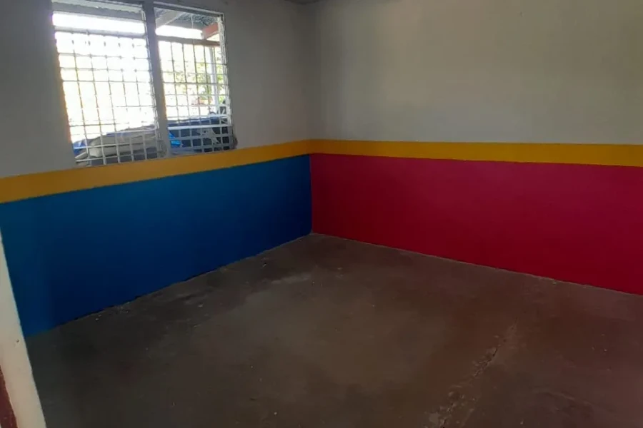 Freshly painted blue, yellow and red walls inside the Gorgona center
