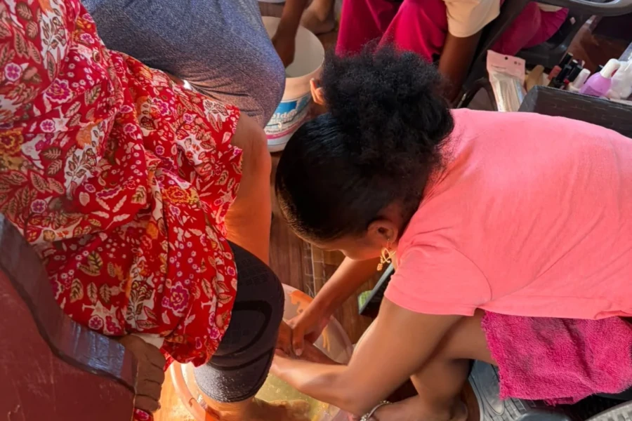 Volunteers assist a guest with personal care during the senior outreach