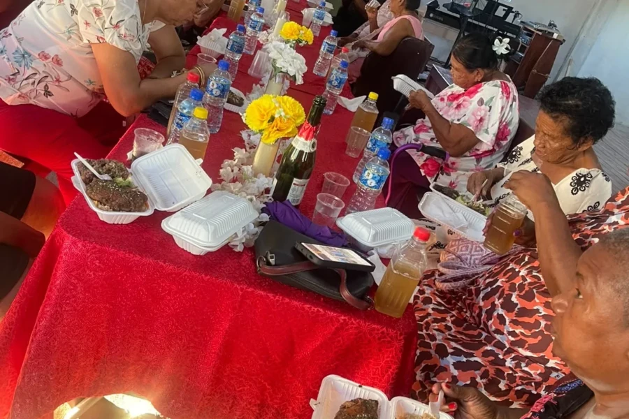 Older adults enjoy meals together at the CGMOH Guyana outreach