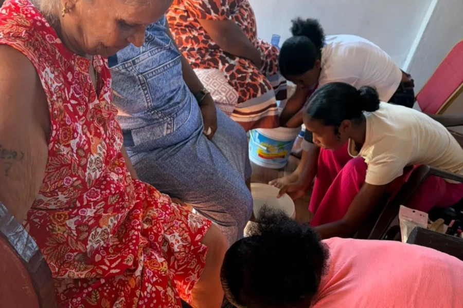 Volunteers work together to provide personal care during the Guyana event