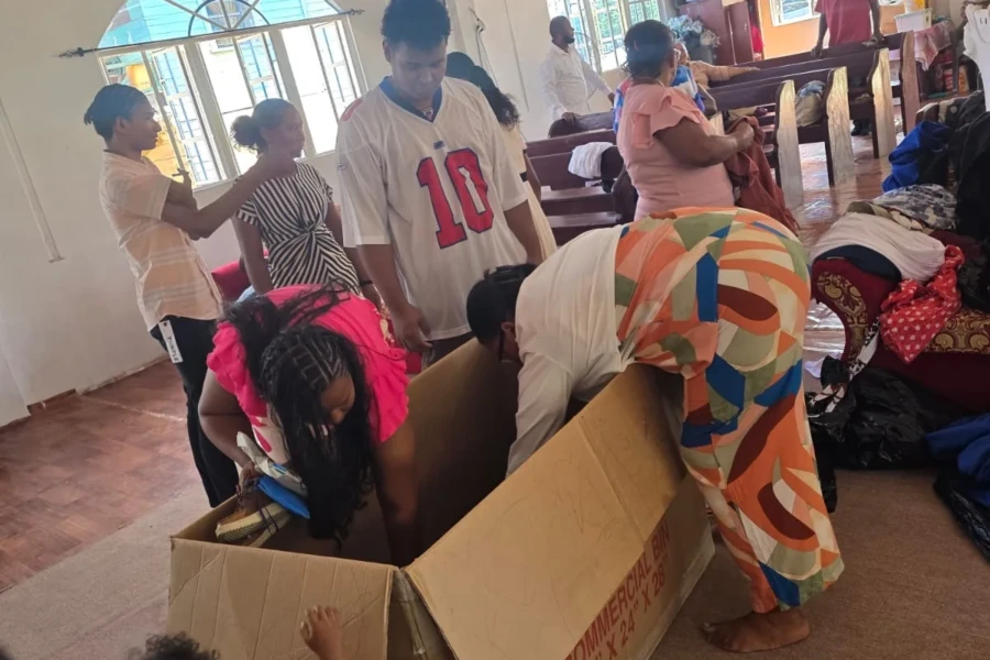 Community volunteers sort clothing donations for children and families