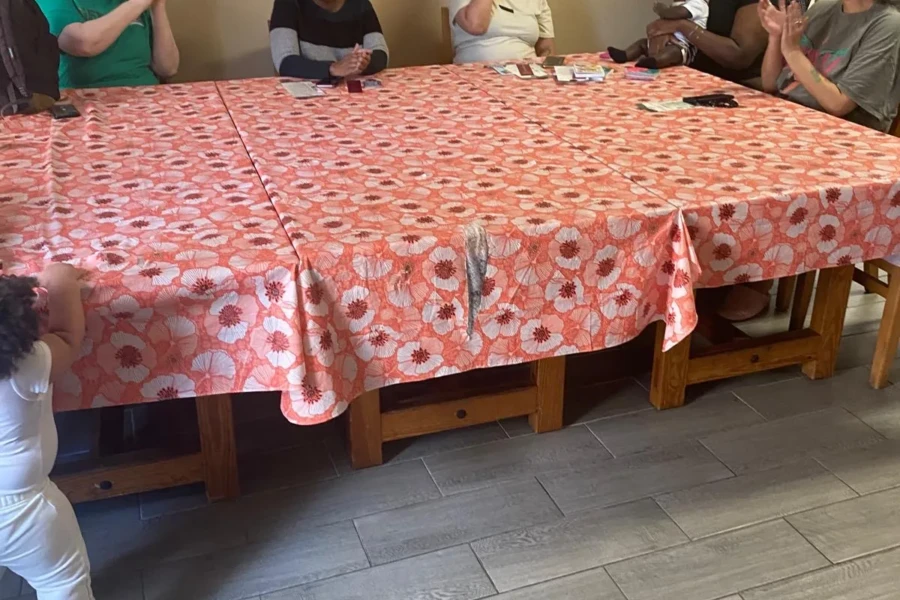 Guests share a Mother's Day meal around a flower-covered table