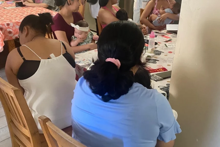 Women enjoy conversation and fellowship around the Mother's Day table