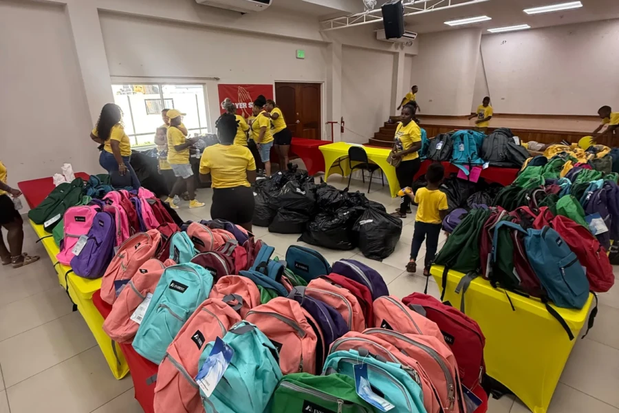Colorful backpacks arranged for the CGMOH Trinidad back-to-school outreach