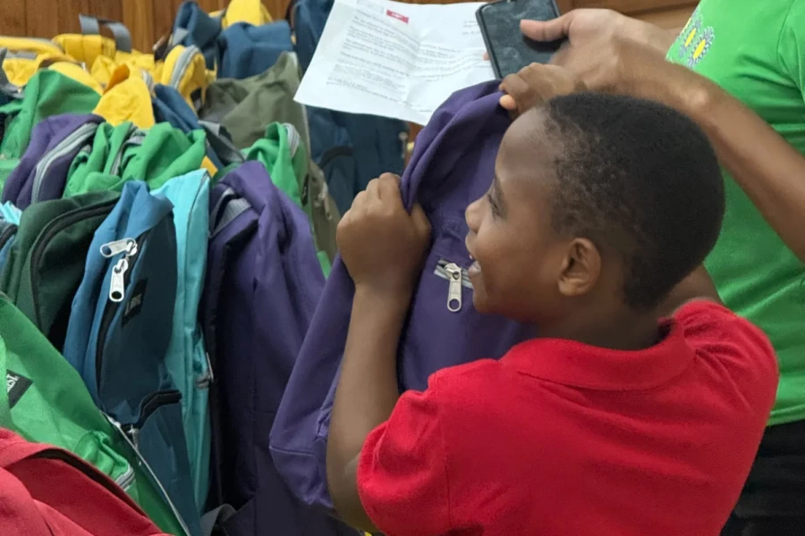 A child chooses school clothing and supplies during the Trinidad outreach