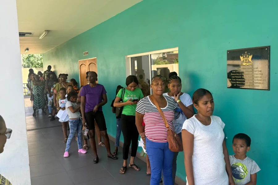 Families wait together at the Trinidad back-to-school distribution